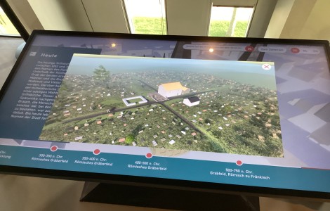 Touchtisch mit sicht auf Landschaft mit kleinen Häusern