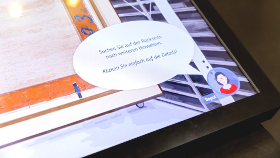Tipps der Forscherin zur Anwendung. Foto: Anette Hiller Bildschirmausschnitt der Touch-Station zur Provenienz-Forschung mit gezeichneter Person und Sprechblase